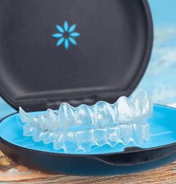 At Holt Orthodontics in Twinsburg, OH, a set of clear aligners in an open blue and black case showcases the convenience of an Invisalign payment plan.