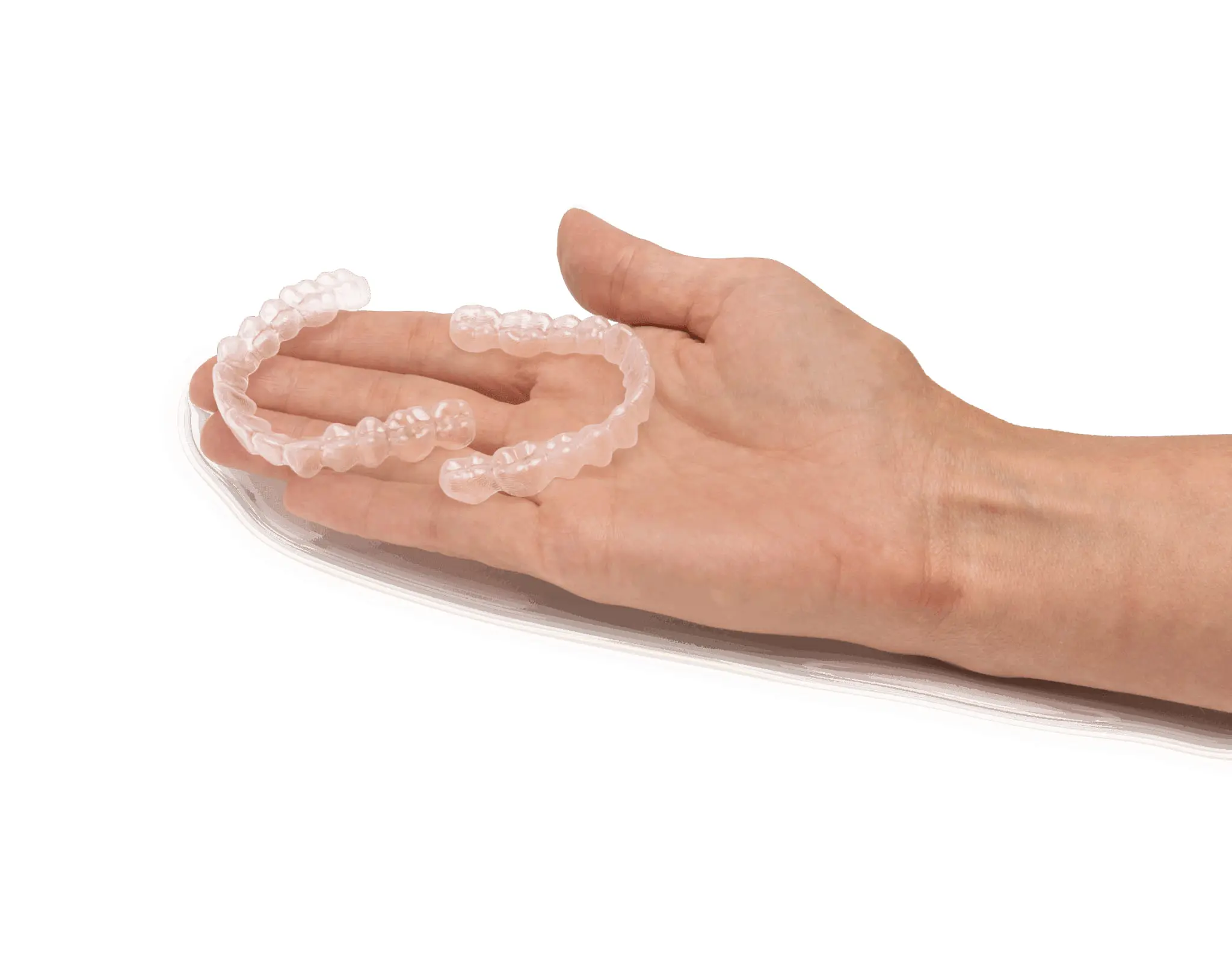 A hand displays two Angel aligners, featuring Holt Orthodontics in Twinsburg, OH, against a white background.