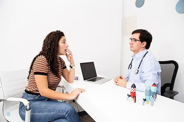 At Holt Orthodontics in Twinsburg, OH, a woman consults with a doctor about tongue thrust, seated at a desk with a laptop and toy rockets.